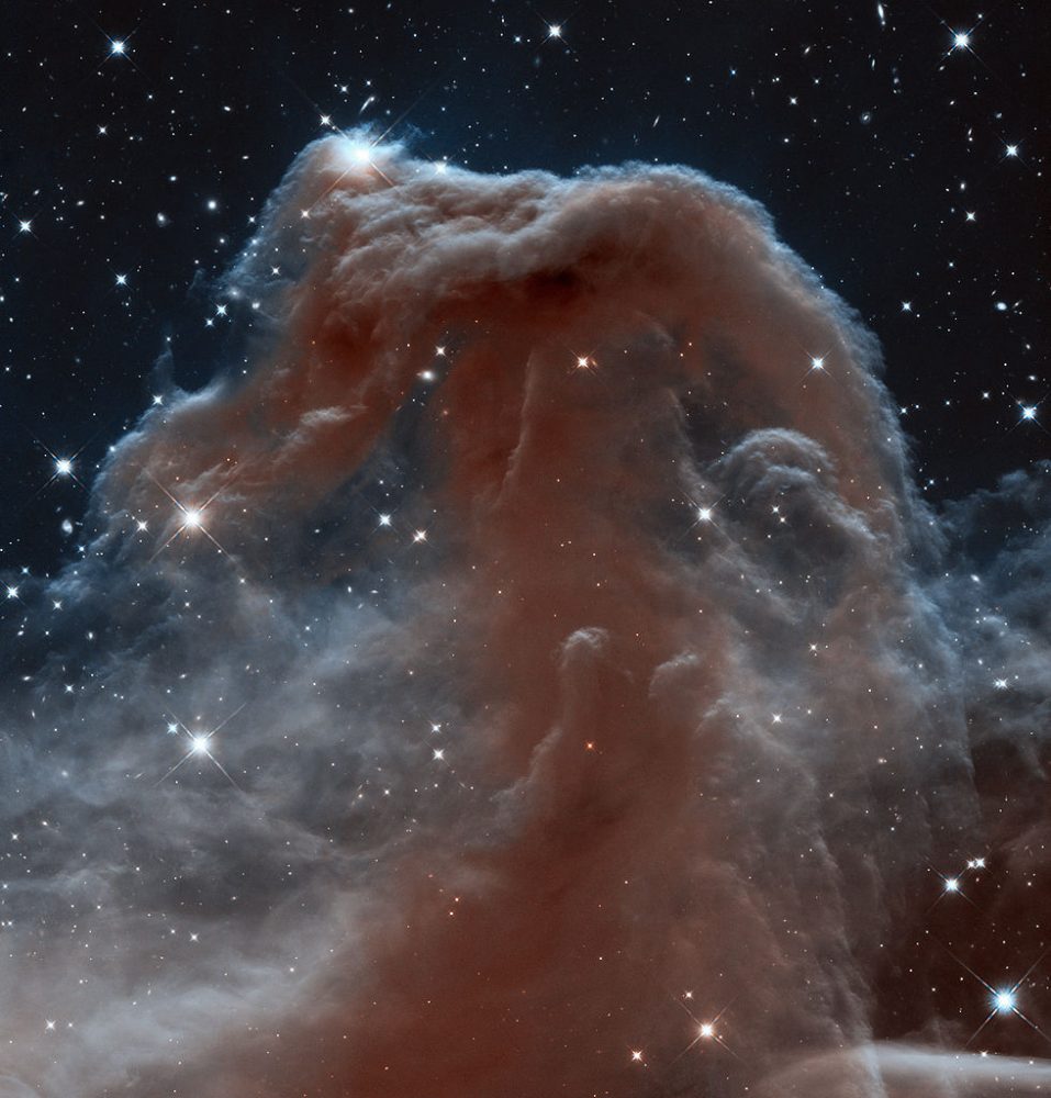 Astronomers have used NASA's Hubble Space Telescope to photograph the iconic Horsehead Nebula in a new, infrared light to mark the 23rd anniversary of the famous observatory's launch aboard the space shuttle Discovery on April 24, 1990. Looking like an apparition rising from whitecaps of interstellar foam, the iconic Horsehead Nebula has graced astronomy books ever since its discovery more than a century ago. The nebula is a favorite target for amateur and professional astronomers. It is shadowy in optical light. It appears transparent and ethereal when seen at infrared wavelengths. The rich tapestry of the Horsehead Nebula pops out against the backdrop of Milky Way stars and distant galaxies that easily are visible in infrared light. Hubble has been producing ground-breaking science for two decades. During that time, it has benefited from a slew of upgrades from space shuttle missions, including the 2009 addition of a new imaging workhorse, the high-resolution Wide Field Camera 3 that took the new portrait of the Horsehead. Image: NASA/ESA/Hubble Heritage Team