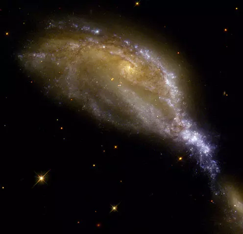 colliding galaxies in lyra