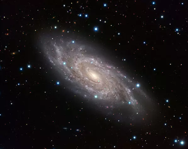 grand design spiral galaxy in serpens,blinking galaxy
